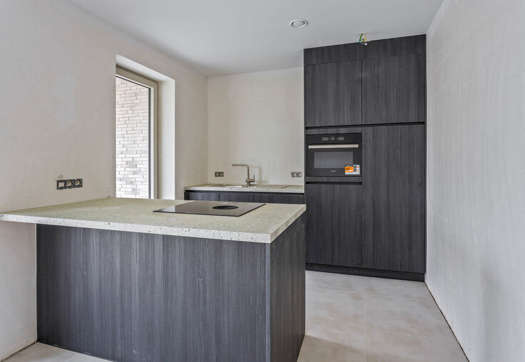 Stijlvol wonen in het hart van Merchtem, met zicht op groen.