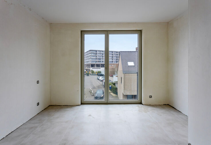 Stijlvol wonen in het hart van Merchtem, met zicht op groen.