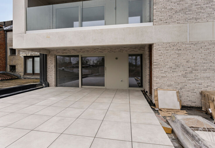 Stijlvol wonen in het hart van Merchtem, met zicht op groen.